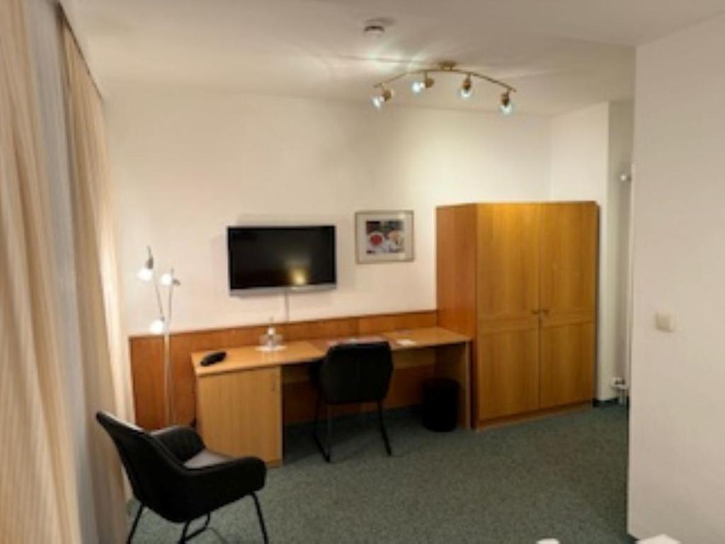 TV a/nebo společenská místnost v ubytování Hotel Occam