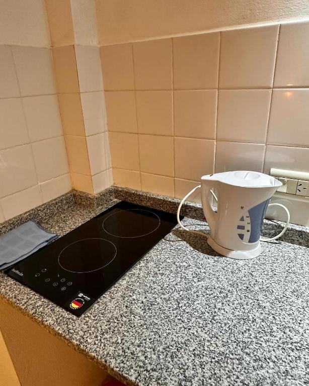 Příslušenství pro přípravu čaje a kávy v ubytování Room Ingá Colón