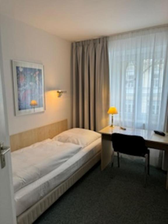 Postel nebo postele na pokoji v ubytování Hotel Occam