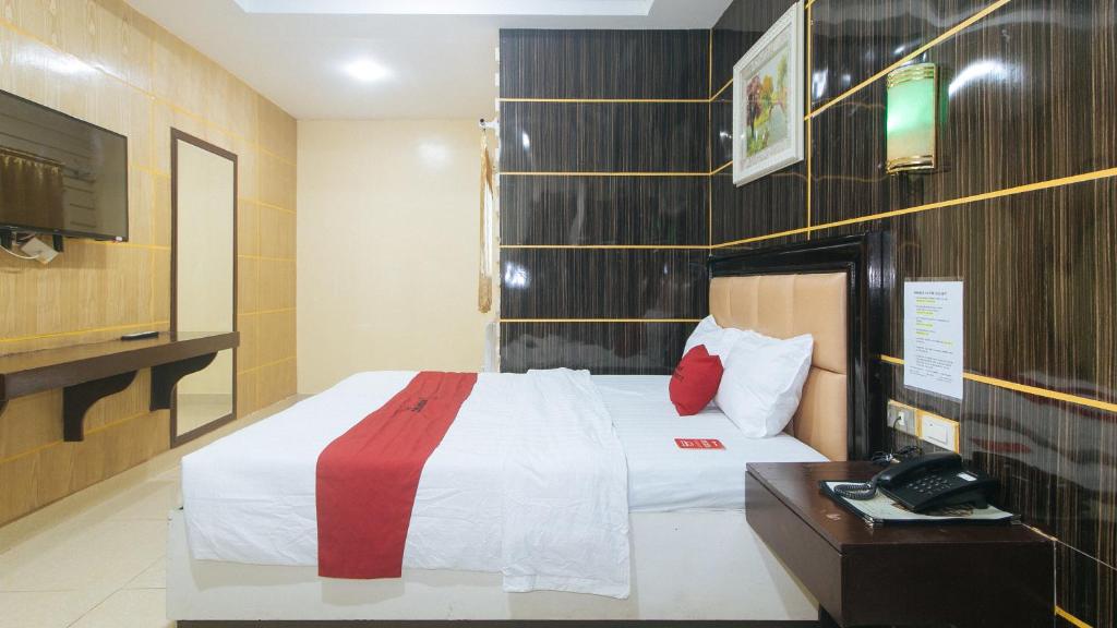 Postel nebo postele na pokoji v ubytování RedDoorz at Winter Hotel Araneta