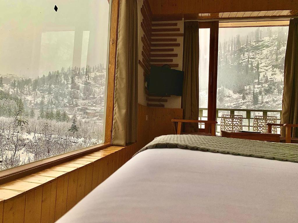 Postel nebo postele na pokoji v ubytování La Aero Resort Home in Snow Mountains