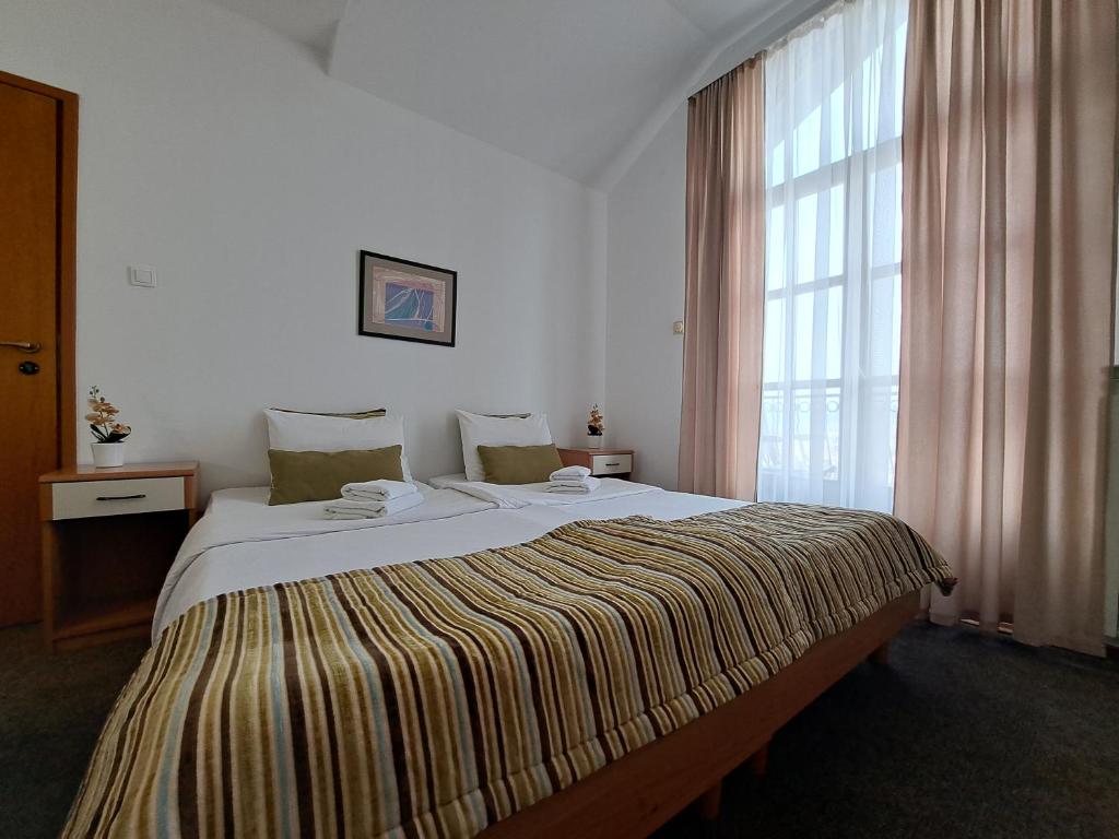 Postel nebo postele na pokoji v ubytování Hotel Marica