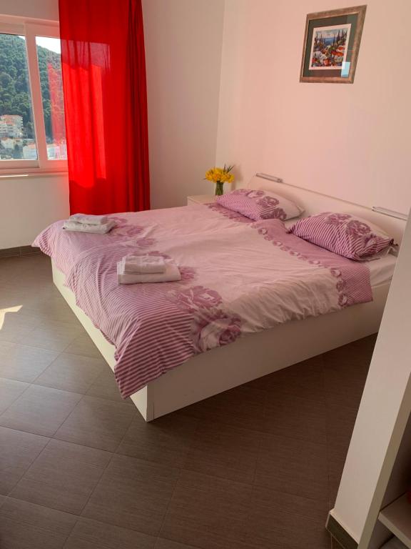 Ένα ή περισσότερα κρεβάτια σε δωμάτιο στο Apartments Orchidea
