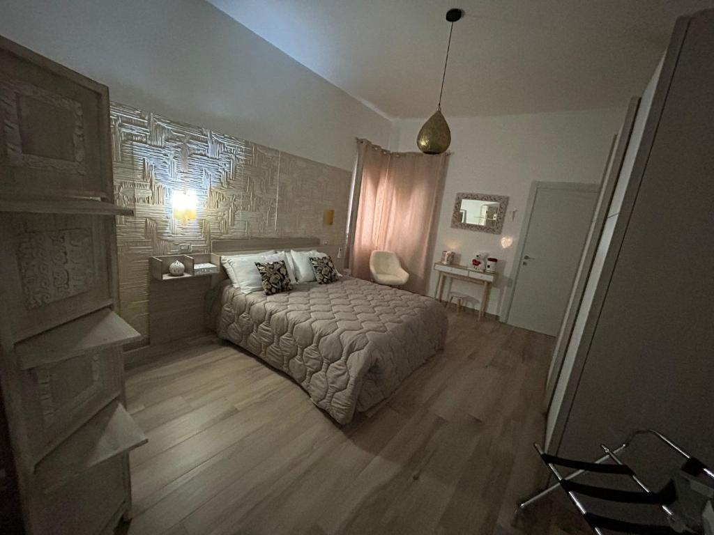 Łóżko lub łóżka w pokoju w obiekcie Casa Vacanze Fiore di Loto
