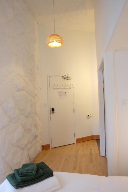 Llit o llits en una habitació de Auberge Mélilot