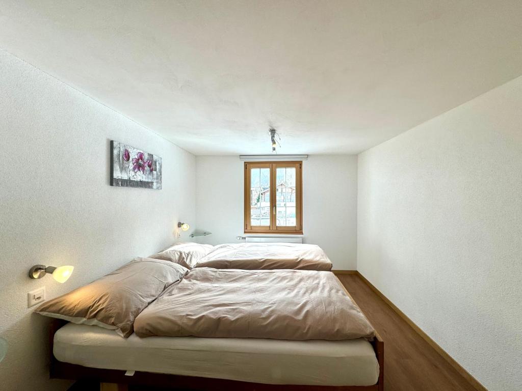 Postel nebo postele na pokoji v ubytování Haus Chalet Arnika