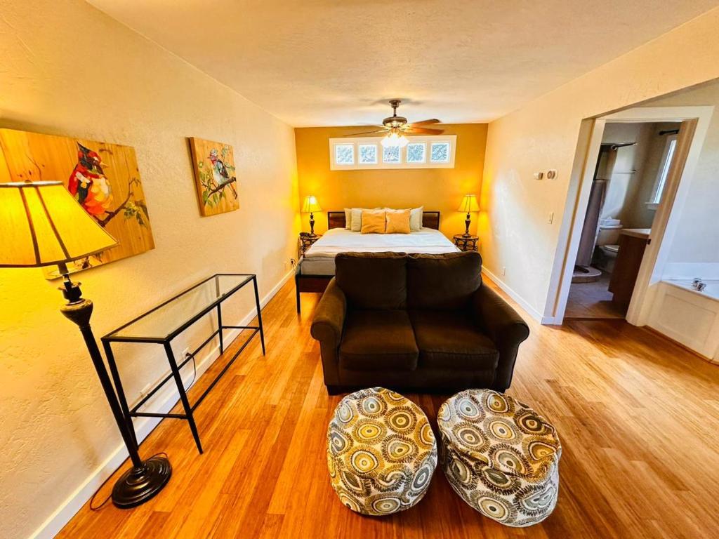 a living room with a bed and a couch at The Inn at Shasta Lake in Lakehead