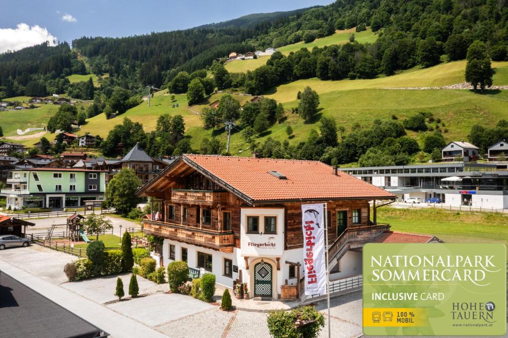 an aerial view of a building in a village at Apartments Fliegerbichl - Familie Voithofer in Bramberg am Wildkogel