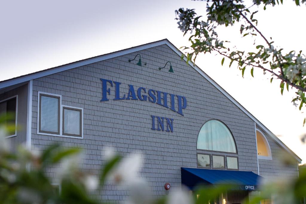 a building with writing on the side of it at Flagship Inn in Boothbay Harbor