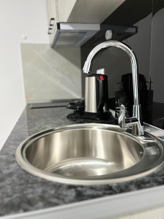 Kuchyň nebo kuchyňský kout v ubytování Viva Apartments