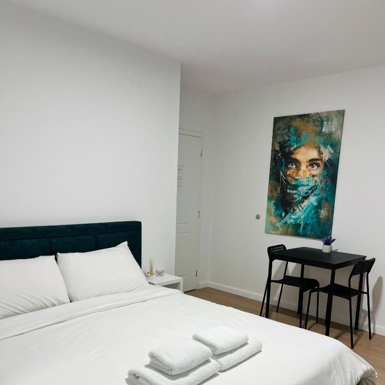 Postel nebo postele na pokoji v ubytování Viva Apartments