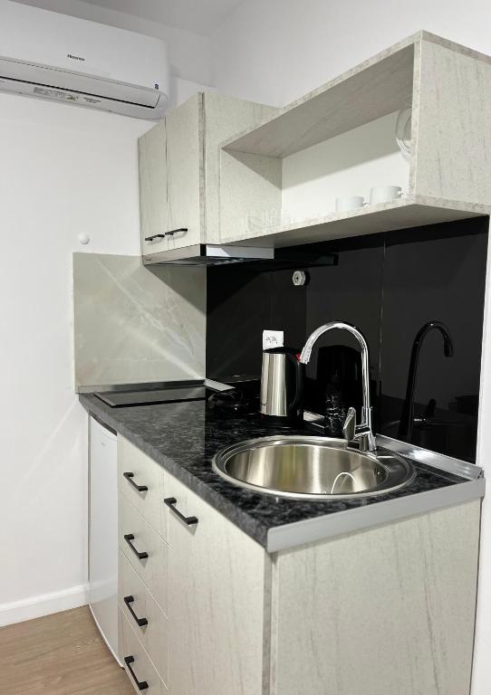 Kuchyň nebo kuchyňský kout v ubytování Viva Apartments