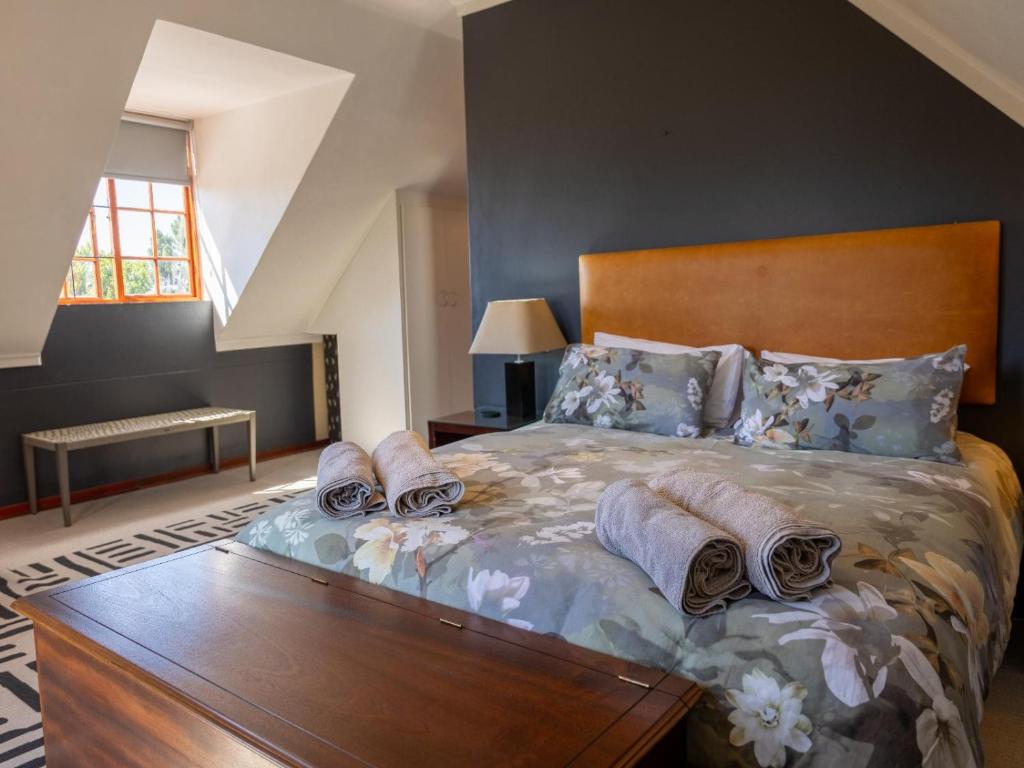 Postel nebo postele na pokoji v ubytování Serenity Lodge