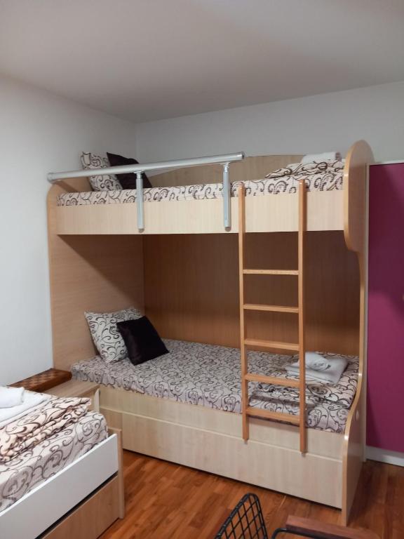 Voodi või voodid majutusasutuse Apartmani Pause toas