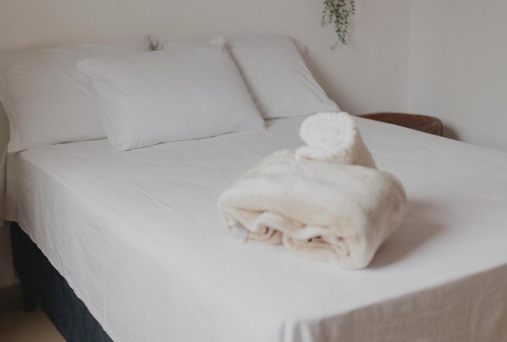 Кровать или кровати в номере Casinhas da Serena - Casa concha