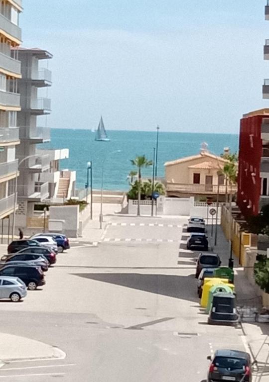 a view of the beach and a sail boat in the water at Vistas al mar in Miramar