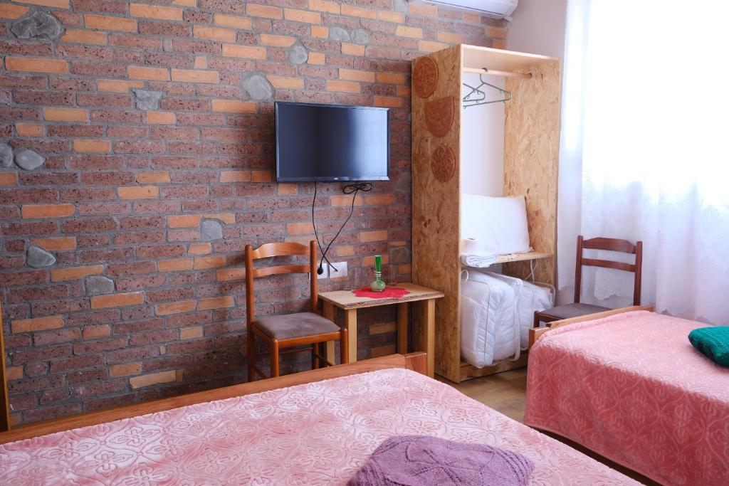 Postel nebo postele na pokoji v ubytování As e vogël, As e madhe