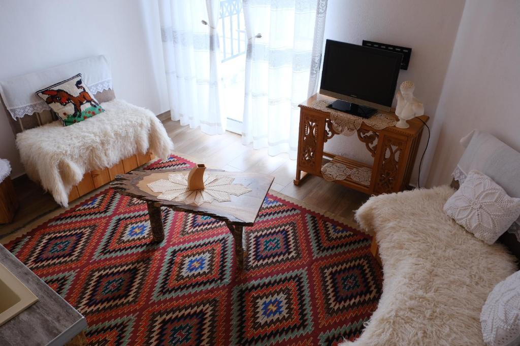 TV a/nebo společenská místnost v ubytování As e vogël, As e madhe