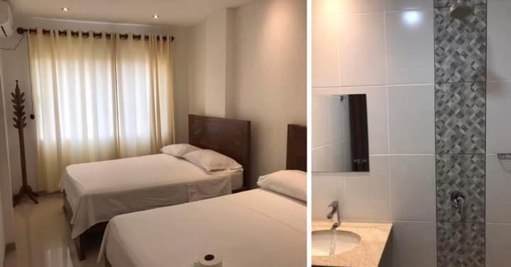 a hotel room with two beds and a bathroom at Hadasa in Santa Cruz de la Sierra