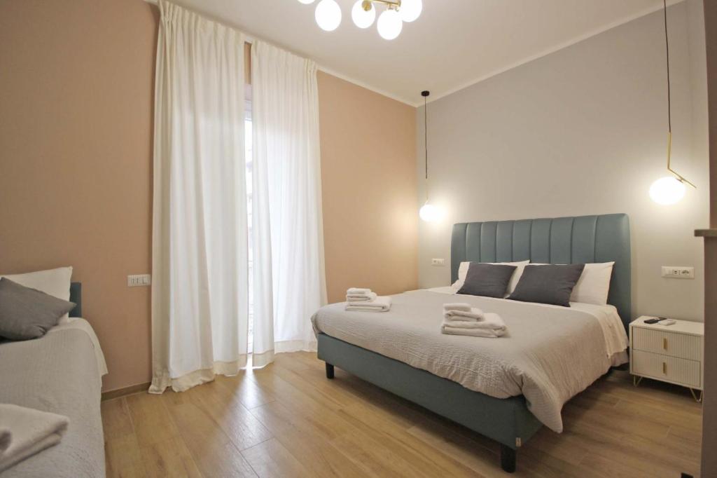 Ένα ή περισσότερα κρεβάτια σε δωμάτιο στο Roma Nostra Luxury B&B