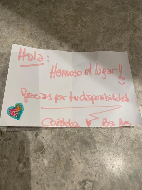 a sign that says homeopathy a boyhappy tuberculosis at Departamento Palermo Hollywood monoambiente in Buenos Aires