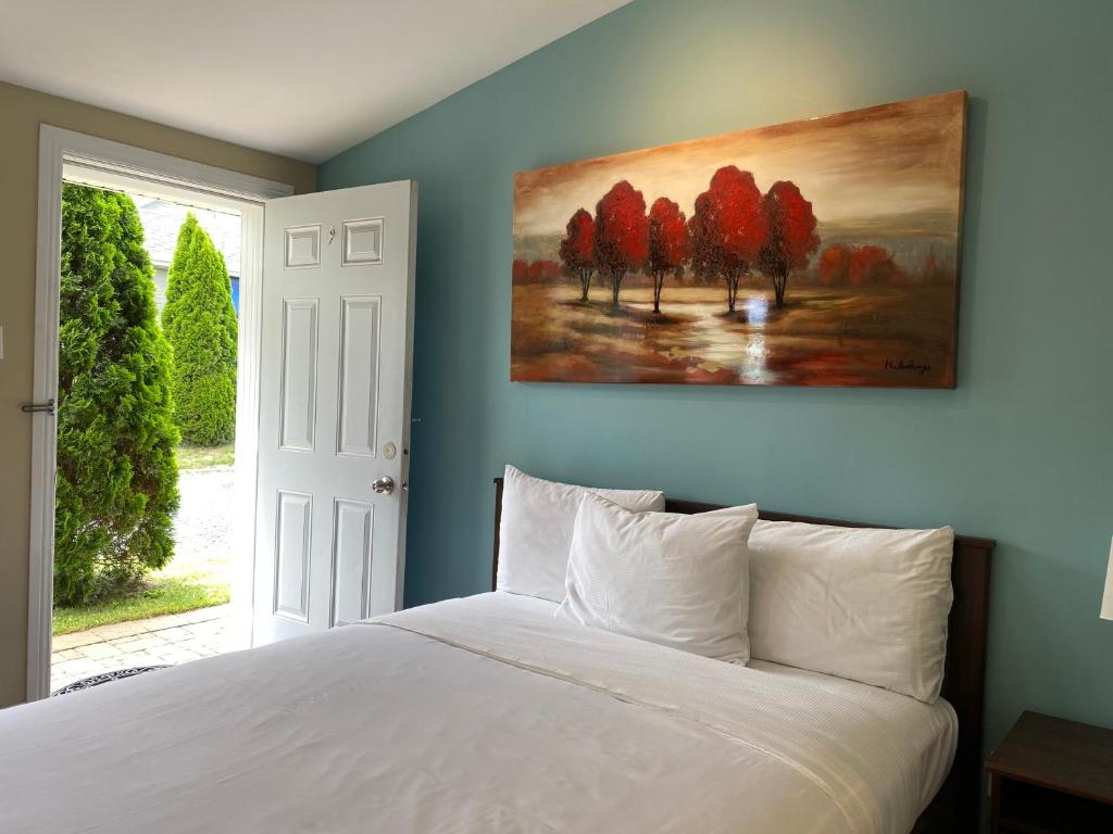 Postel nebo postele na pokoji v ubytování Motel des Cèdres