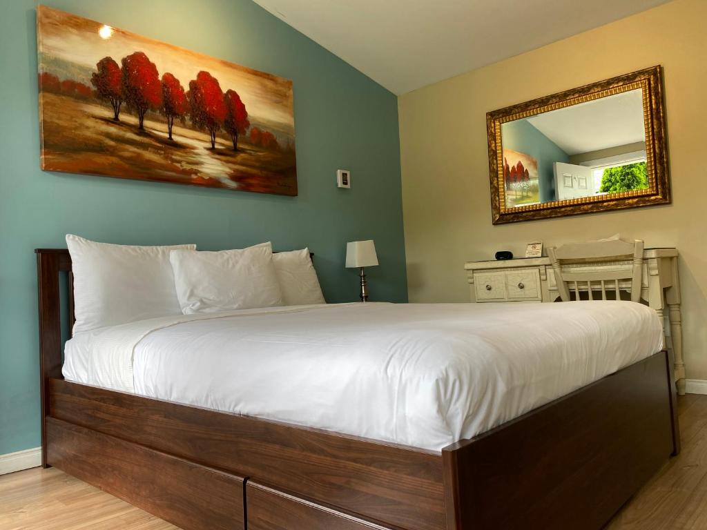 Postel nebo postele na pokoji v ubytování Motel des Cèdres