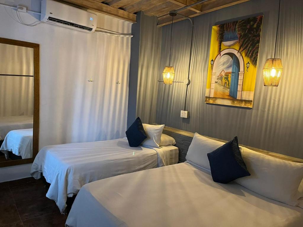 Voodi või voodid majutusasutuse Maloka Boutique Hostel toas