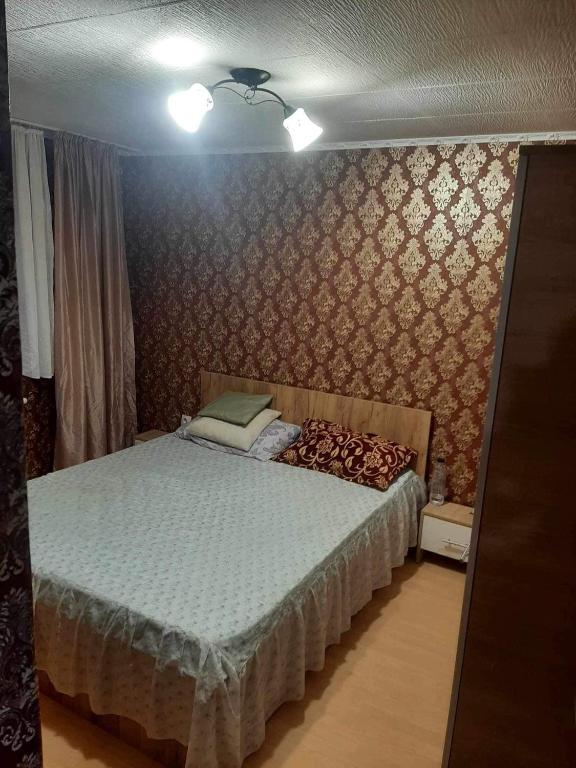 a bedroom with a bed in a room at King srl in Craiova