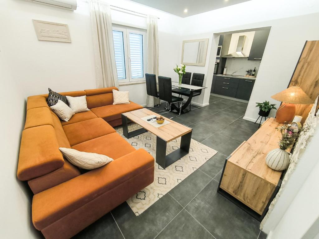 a living room with a couch and a table at Luxury apartment Marko in Dubrovnik
