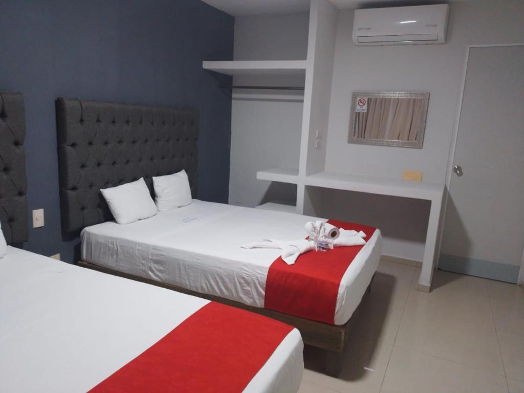 Postel nebo postele na pokoji v ubytování Hotel MCH