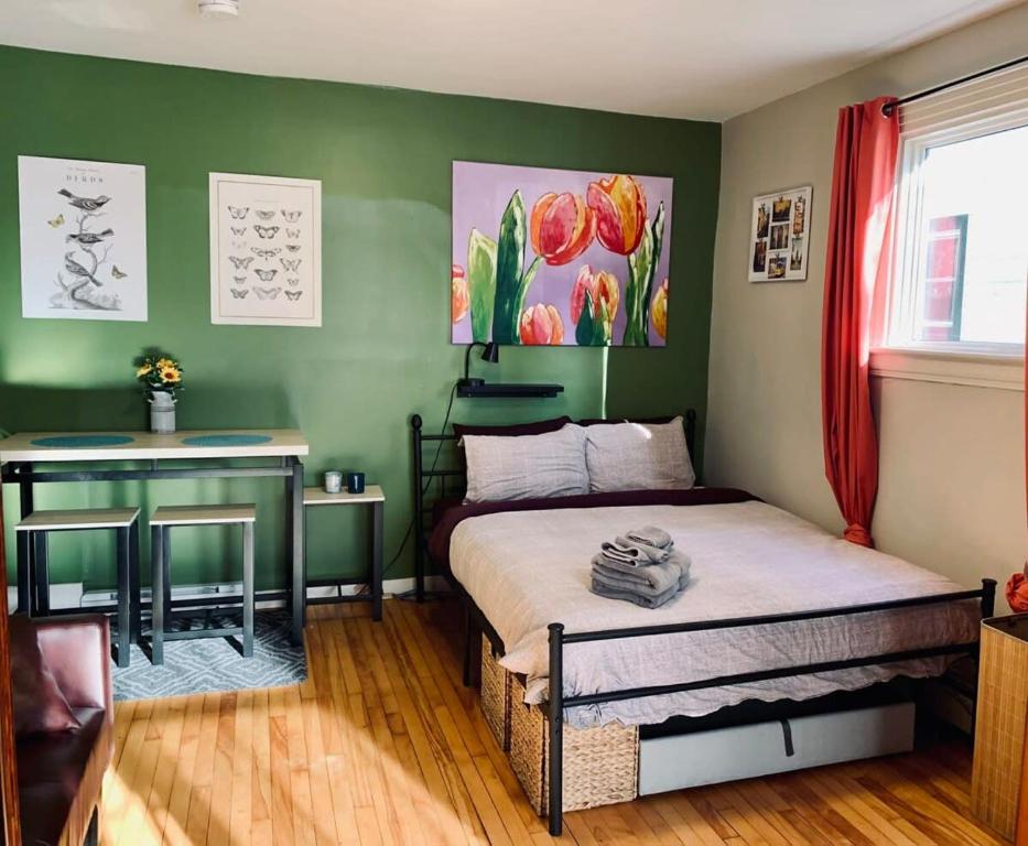 a bedroom with a bed and a desk in it at Comfy Studio #3, Central Location, Parking in Halifax