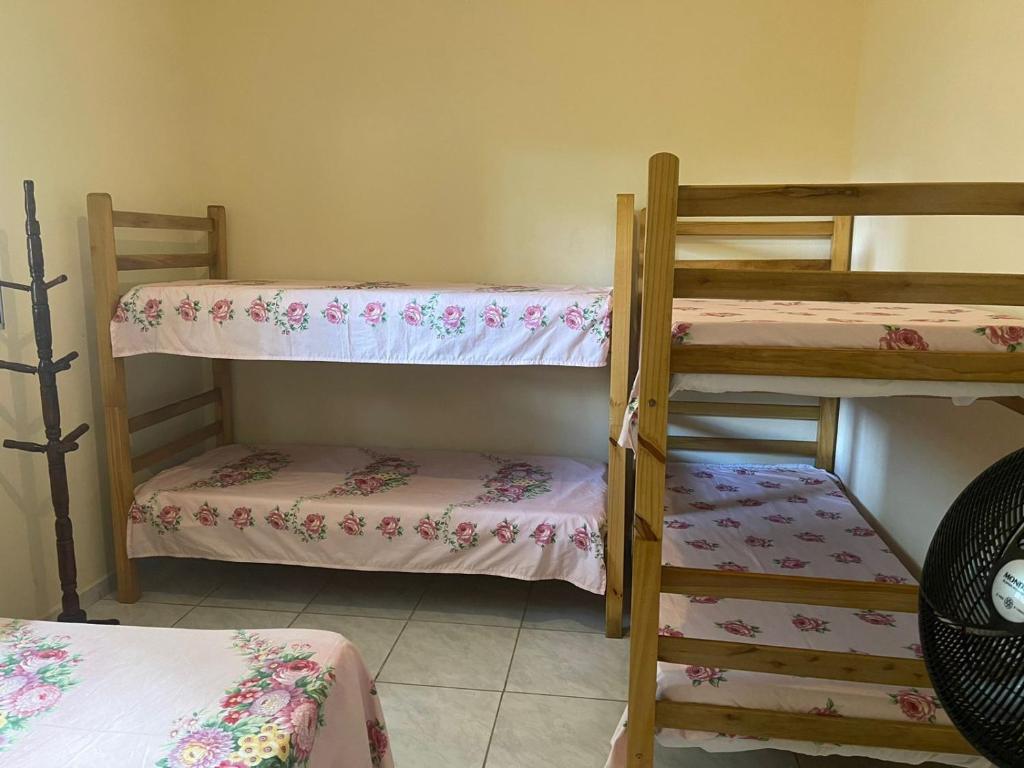 a room with two bunk beds in a room at Long Island in Ilha Comprida