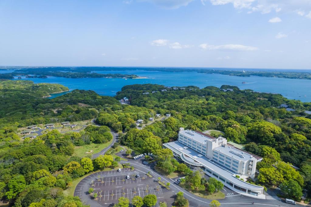 an aerial view of a building next to a lake at Nemu Resort Hotel Nemu in Shima