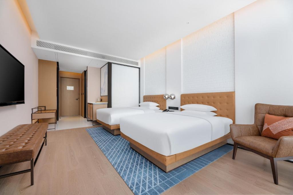 Postel nebo postele na pokoji v ubytování Four Points by Sheraton Xi’an High-Tech Zone