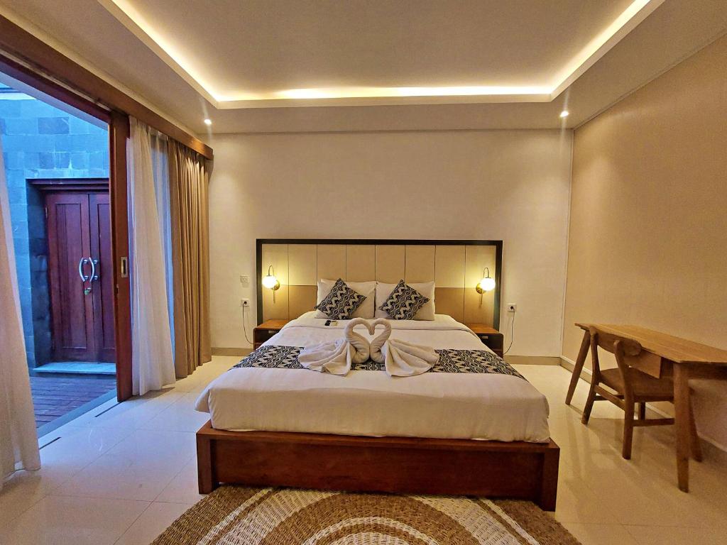 Tempat tidur dalam kamar di Amaras Villa