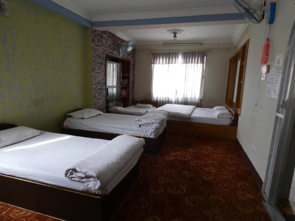 Postel nebo postele na pokoji v ubytování Sara's Backpackers Hotel