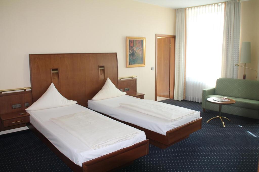 Postel nebo postele na pokoji v ubytování Victoria Hotel