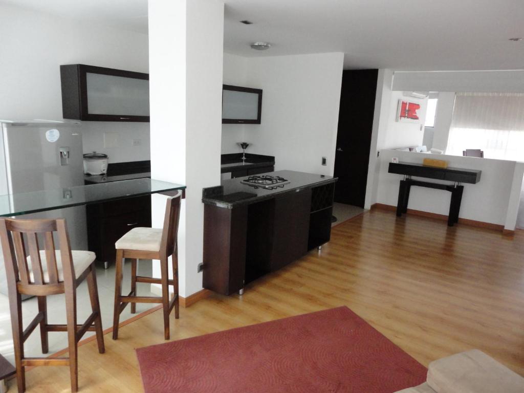 Kuchyň nebo kuchyňský kout v ubytování Monterosa Apartamentos Amoblados
