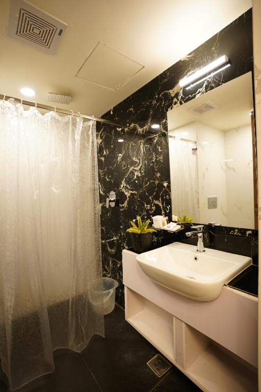 Koupelna v ubytování DrizzleDrop Inn Chennai