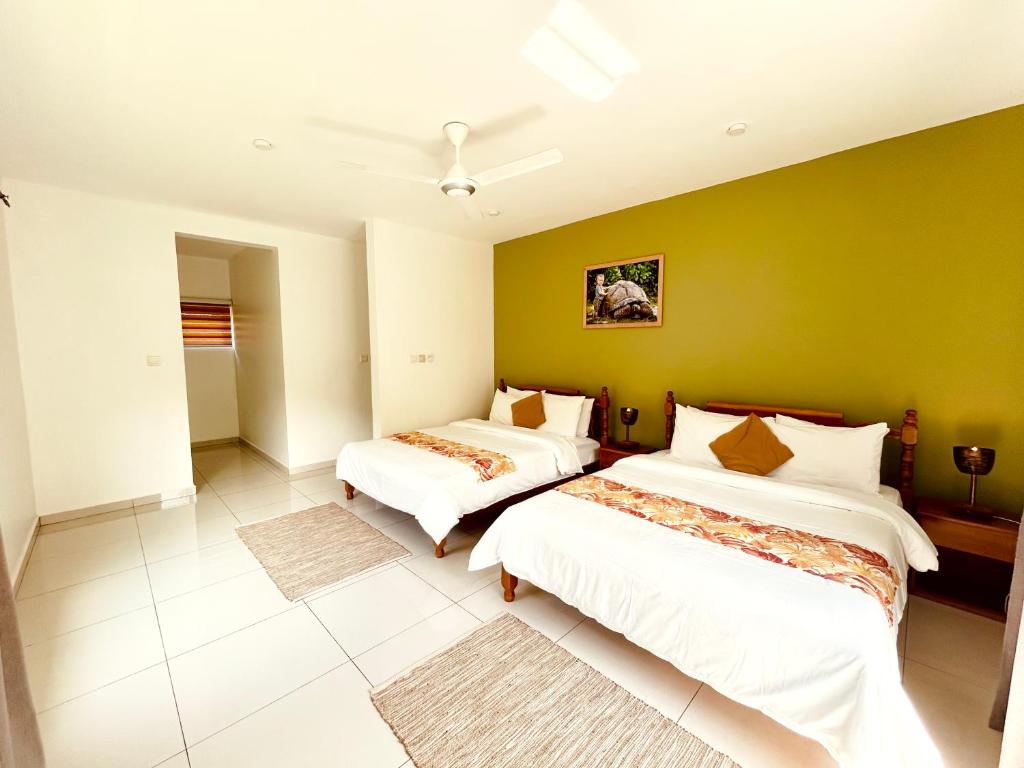 Postel nebo postele na pokoji v ubytování The Seaboards Apartments Seychelles