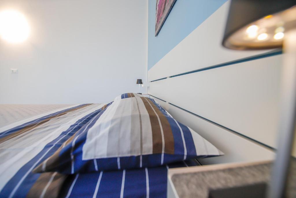 Postel nebo postele na pokoji v ubytování Moderno alloggio in zona pedonale