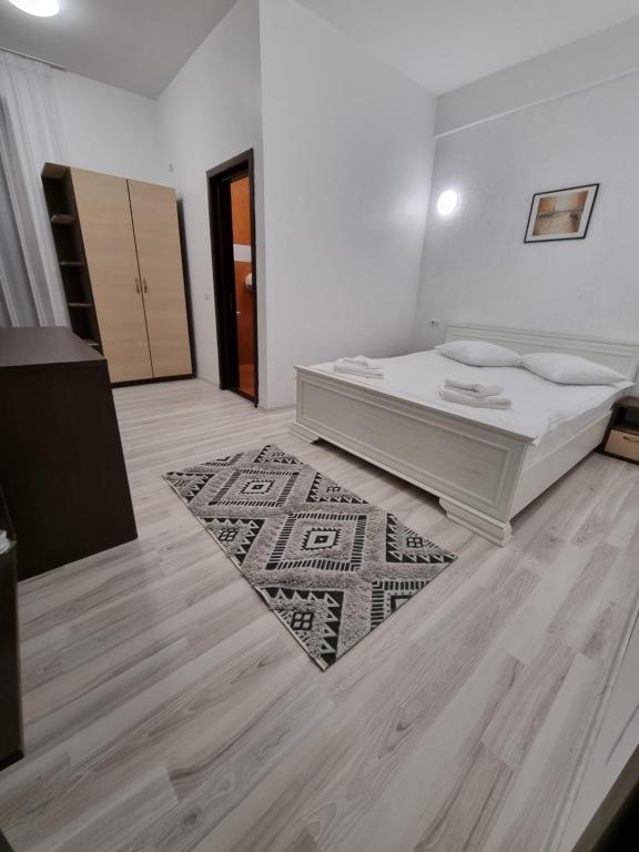 Postel nebo postele na pokoji v ubytování Hotel Perla Oltului