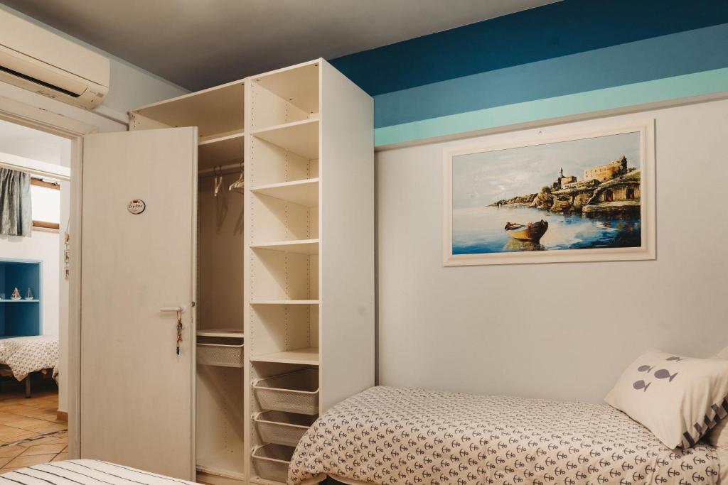 Posteľ alebo postele v izbe v ubytovaní Alloggi Turistici con Piscina Palestra Jacuzzi Sauna - All Inclusive