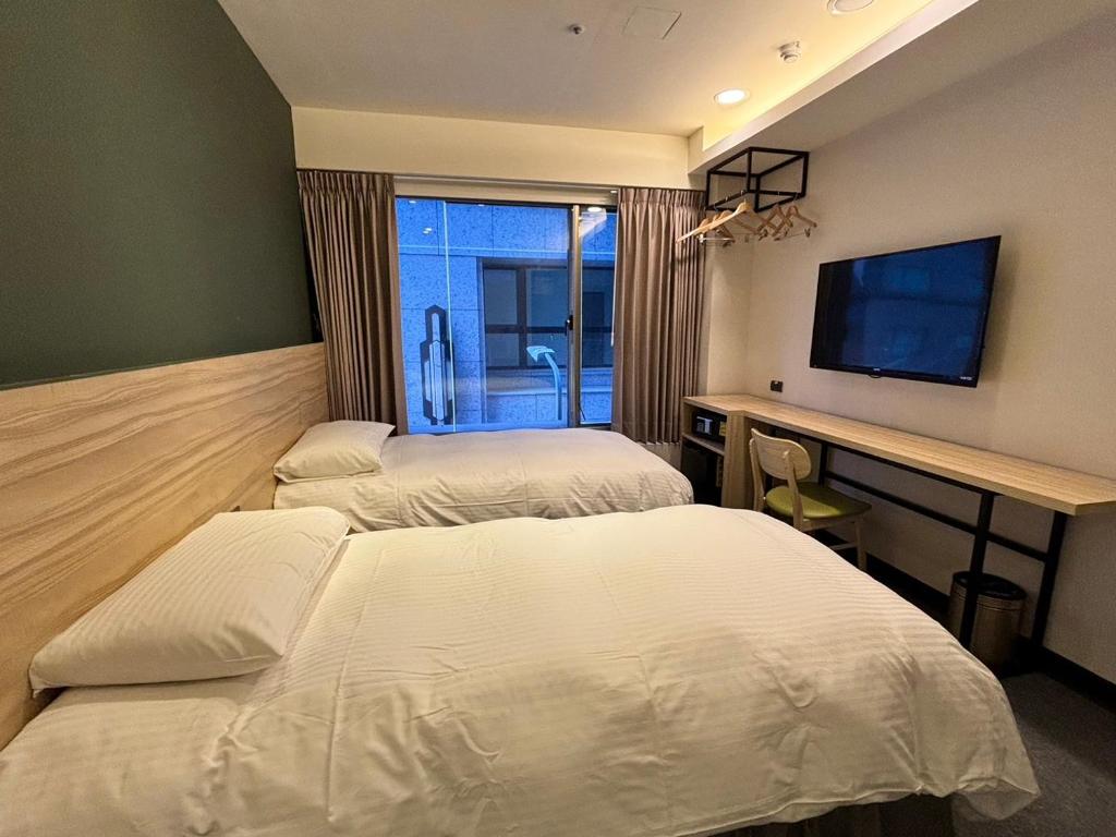 Voodi või voodid majutusasutuse Formosa 101 Taipei Main Branch toas