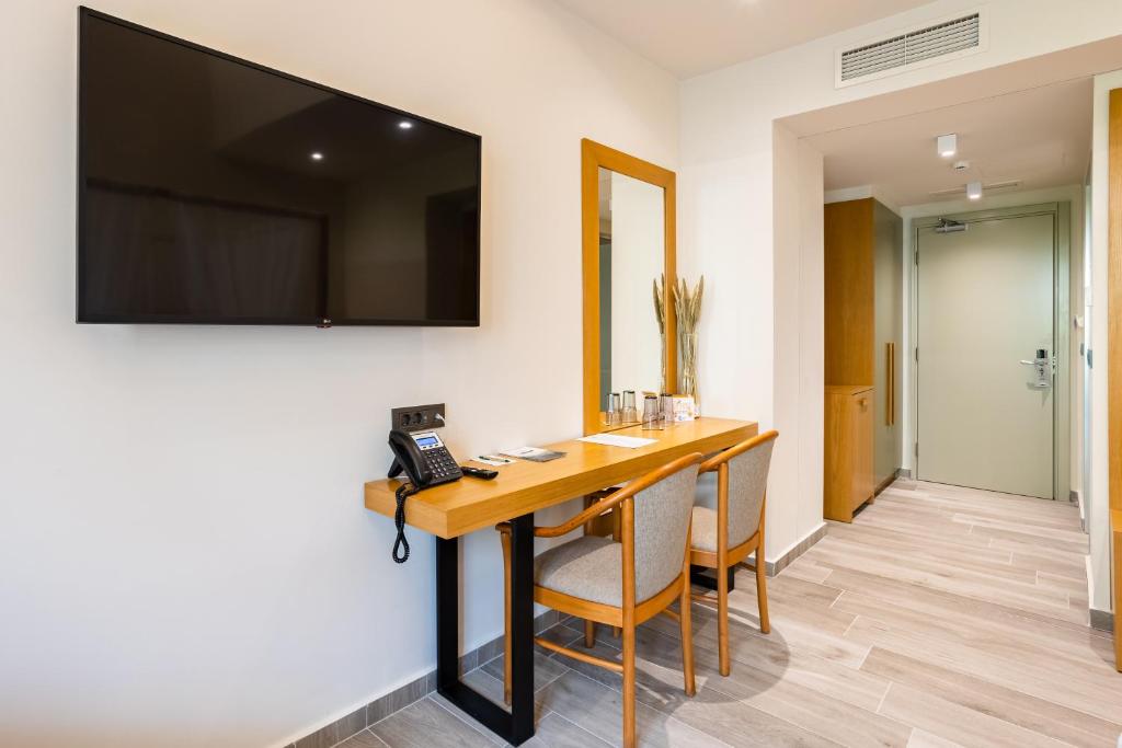 TV a/nebo společenská místnost v ubytování Denthis Hotel - Taygetos Mountain Getaway