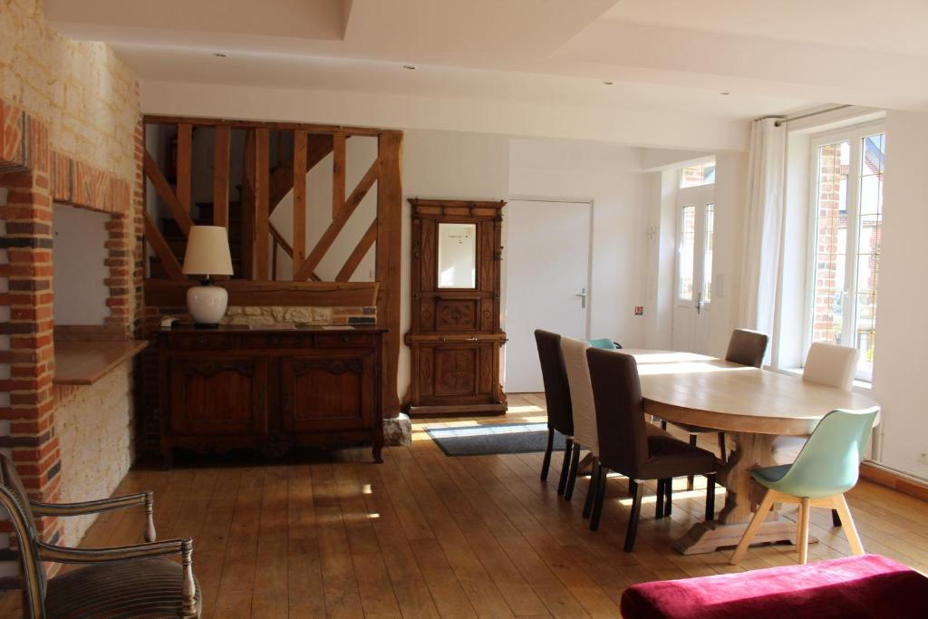 a dining room with a table and chairs at Domaine du Clos Fleuri - Spa in Honfleur