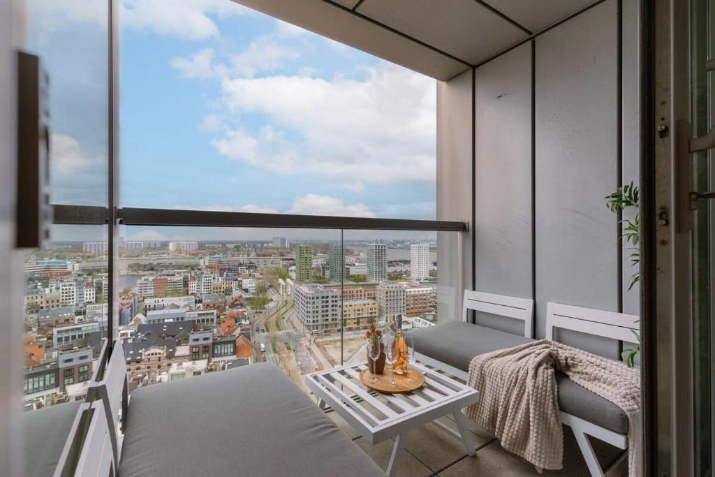 a balcony with a view of a city at Huswell - Apartment with beautiful view of Antwerp in Antwerp