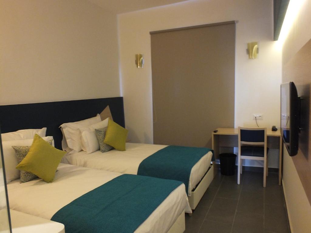 Postel nebo postele na pokoji v ubytování Hotel Relax Marrakech