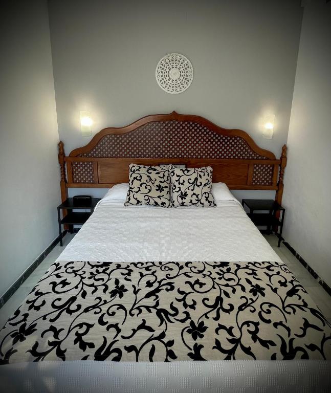 Postel nebo postele na pokoji v ubytování Hotel Los Omeyas
